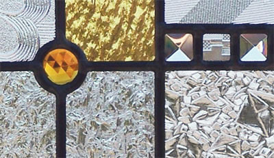 Closeup of stained and leaded glass abstract window