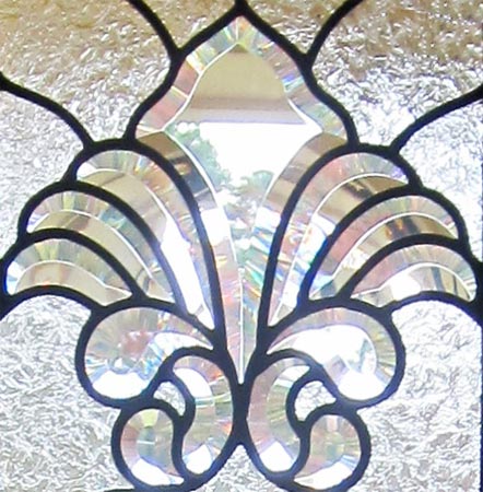 Closeup of custom leaded glass door windows with Infinity bevels