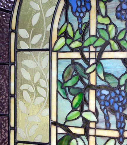 Closeup of custom stained and leaded glass Victorian style Wisteria window