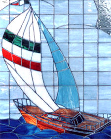 Closeup of large custom stained and leaded glass sailboat window