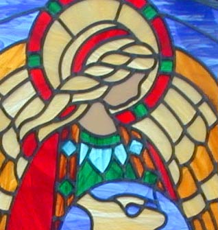 Custom stained and leaded glass angel has the whole world in her hands