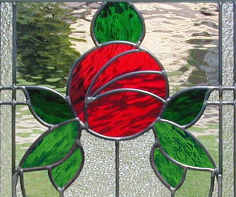 Closeup of custom stained glass Victorian style rose window