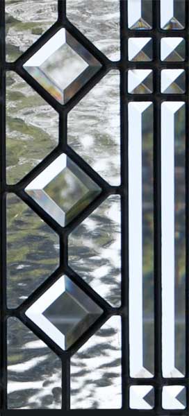 Closeup of custom leaded glass abstract transom window