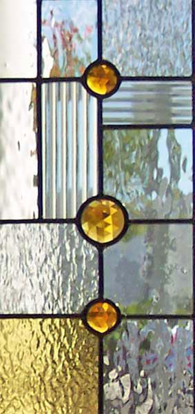 Closeup of custom abstract FLW leaded glass door window