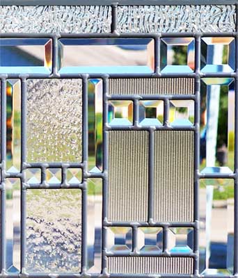 Closeup of leaded glass beveled abstract window of clear textured glass