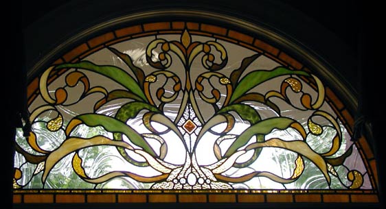 Hogan arched stained and leaded glass window
