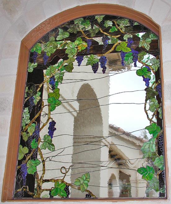 Closeup of custom stained glass Victorian style grapes window