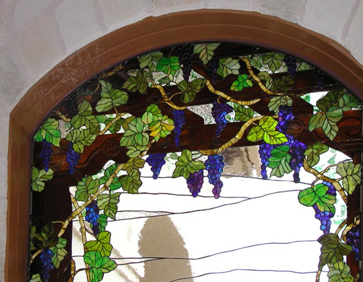 Closeup of custom stained glass Victorian style grapes window