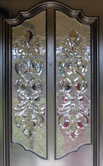 Closeup of custom leaded glass door windows with Infinity bevels
