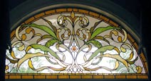 Custom stained and leaded glass arched window