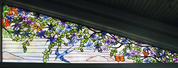 Custom trumpet vine, birds and butterflies stained glass window
