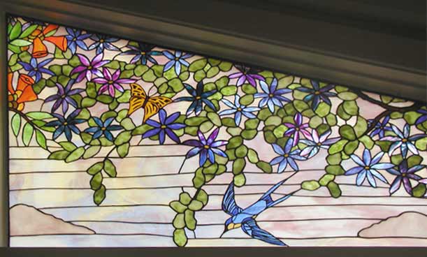 Custom trumpet vine, birds and butterflies stained glass window