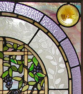 Closeup of custom stained and leaded glass Victorian style Wisteria window